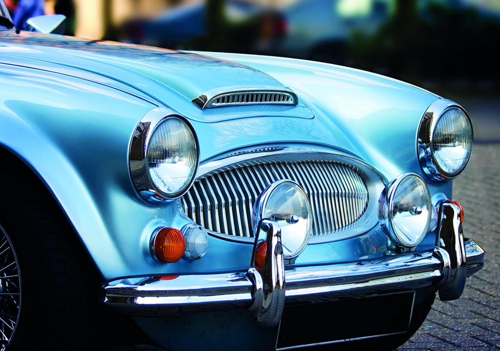 A classic shiny metallic blue sports car